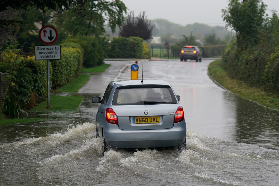 Widespread flooding as a result of heavy rain has seen traffic chaos break out, including the closure of a busy A-road