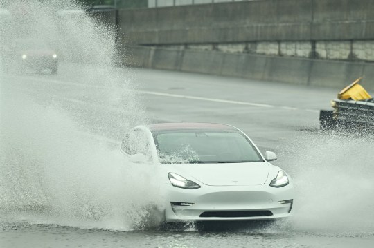 Mandatory Credit: Photo by Christopher Oquendo/ZUMA Press Wire/Shutterstock (14742351q) A car drives through a flooded roadway as Atlanta is facing inclement weather ahead of Hurricane Helene. Hurricane Helene 2024: Atlanta Prepares, Georgia, USA - 26 Sep 2024