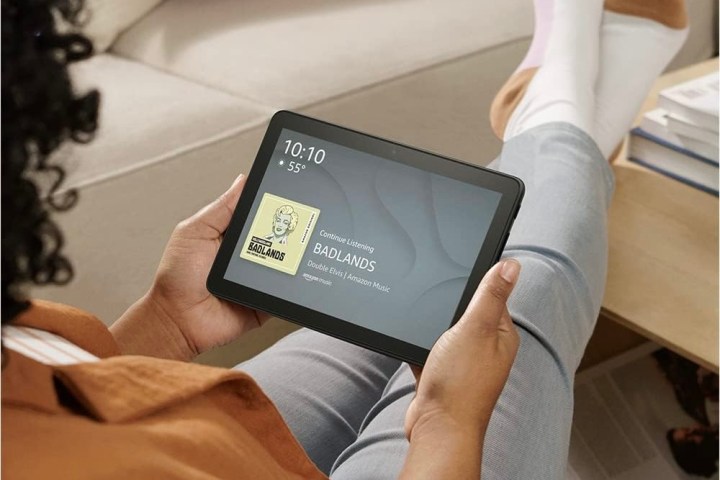 A person using the Amazon Fire HD 8 tablet.