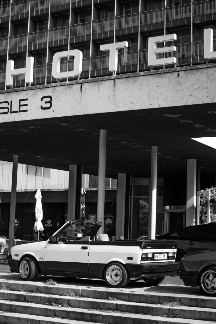 A Zastava Yugo Cabrio in front of the Hotel Yugoslavia in Belgrade