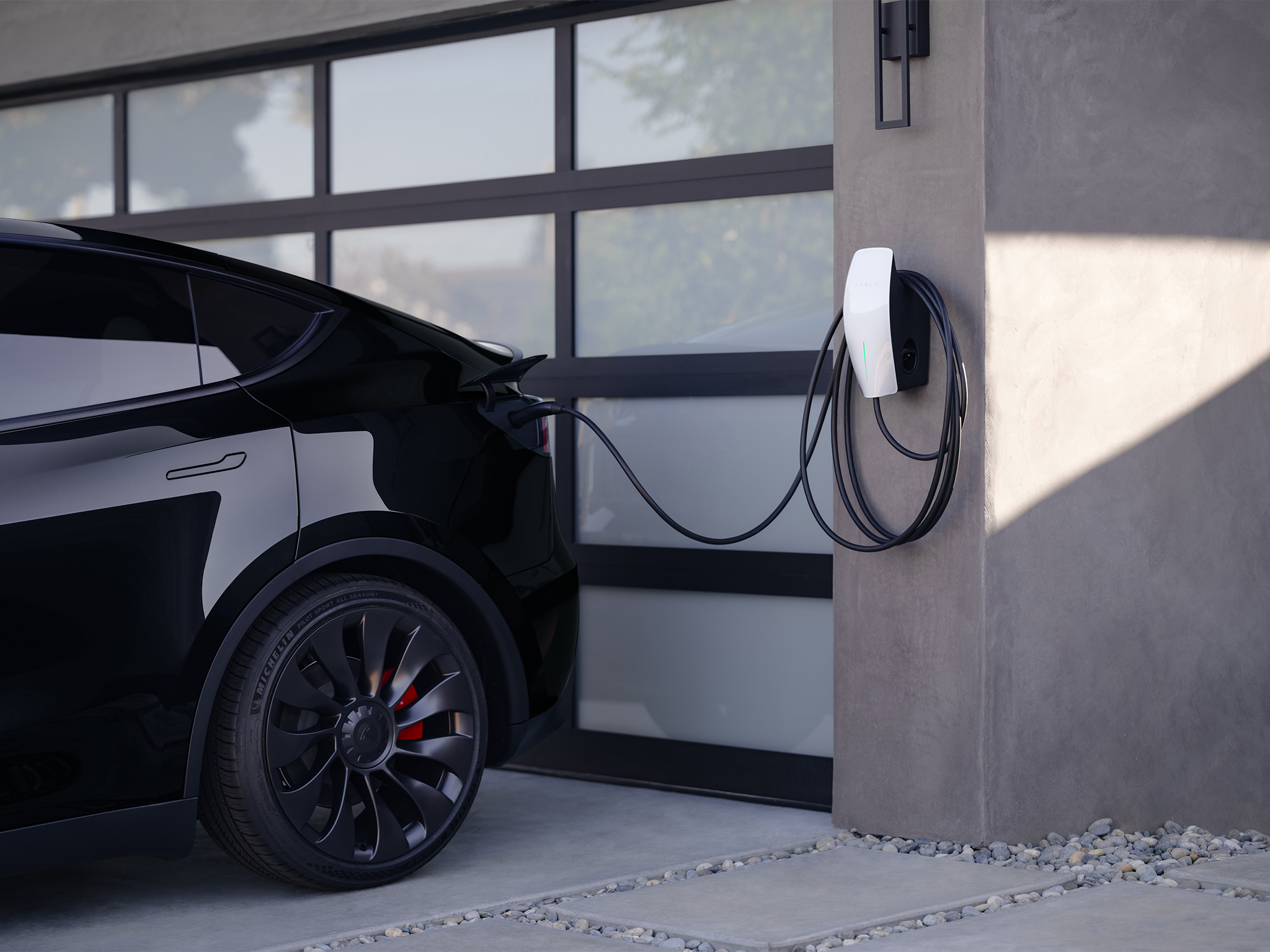 Most car batteries are large enough to power a home overnight. Pictured: A Tesla universal wall connector