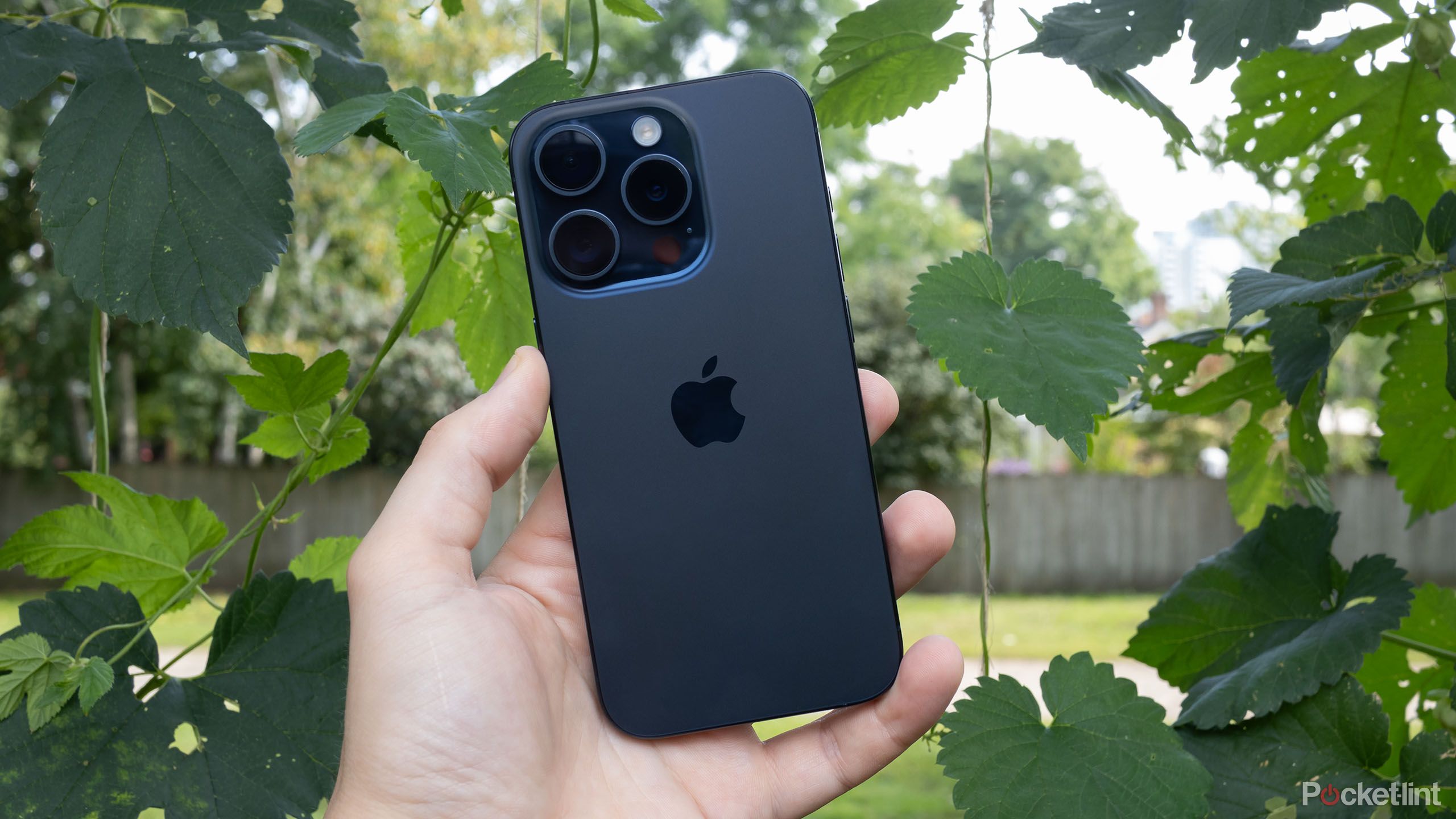 An iPhone 15 Pro outdoors.