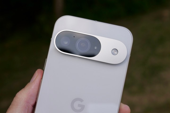 A person holding the Google Pixel 9, showing the camera.