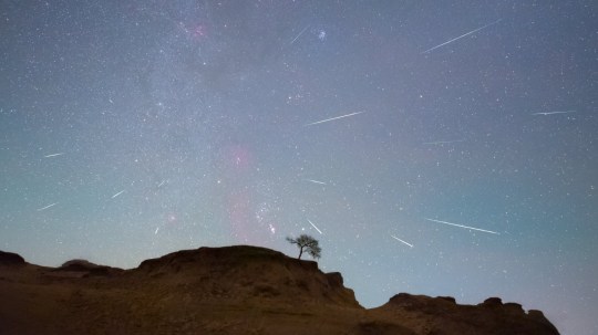 The Orionids meteor shower is seen over the Songhua River in Daqing City, Heilongjiang Province, China.