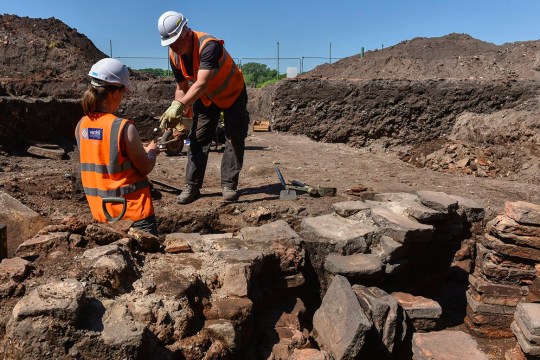 Archeologists at the bath house dig.