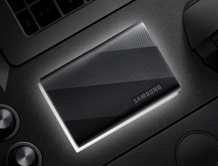 Samsung T9 portable SSD placed nest to a laptop.