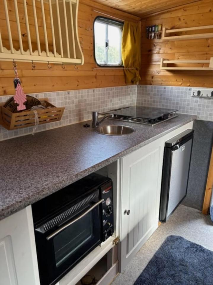 It features a fully functioning kitchen