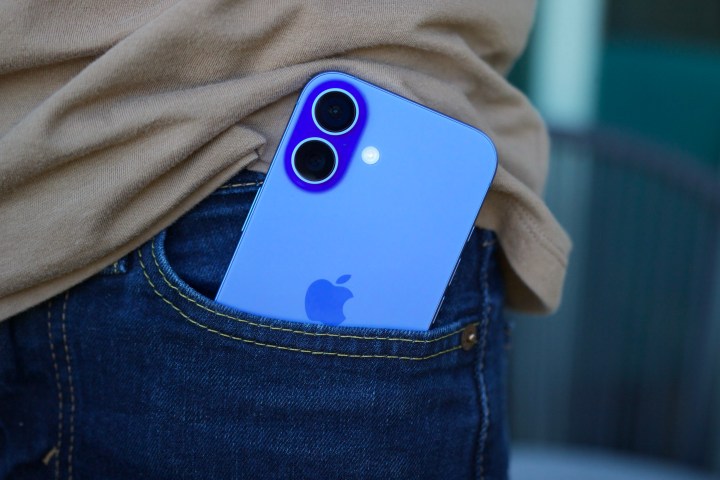 The iPhone 16 sticking out of someone's pocket.