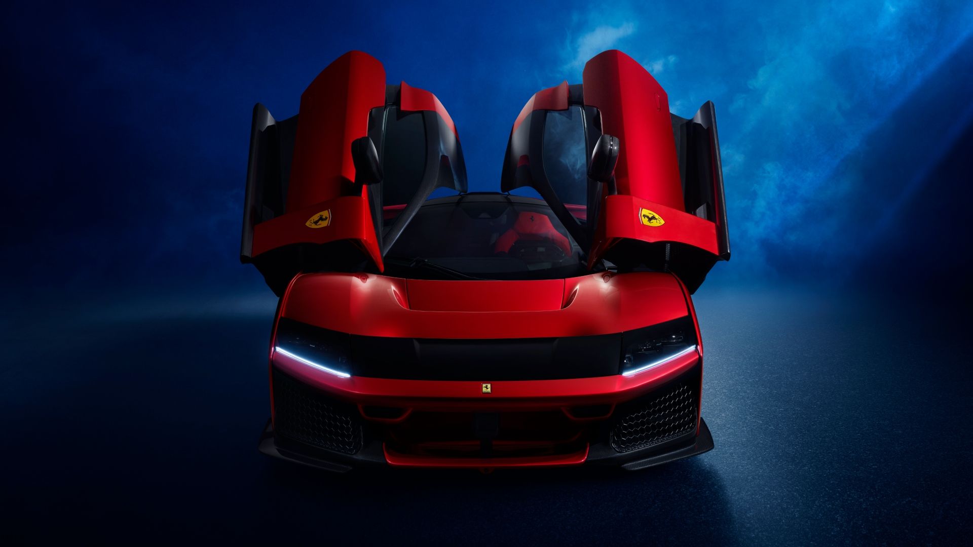 Front-end shot of a red Ferrari F80 with the doors open