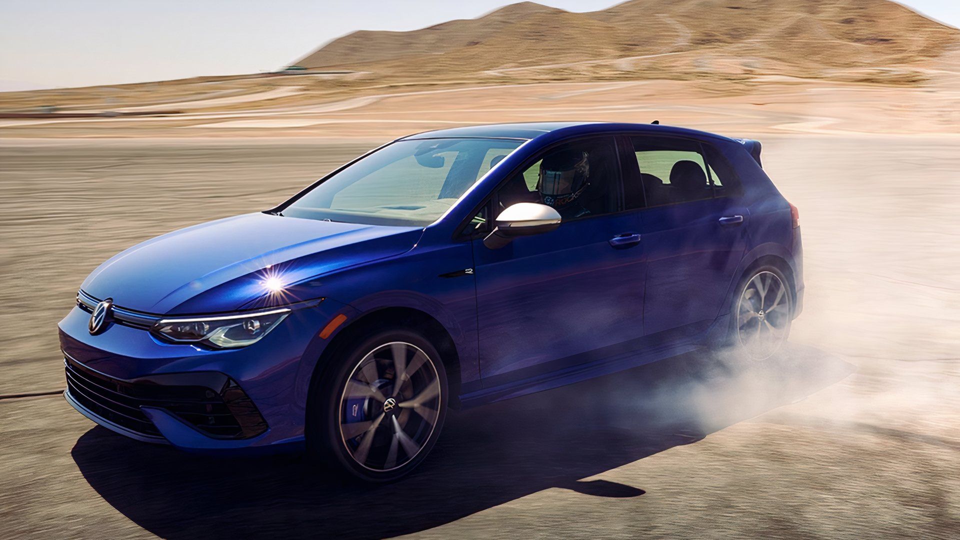 2024 Volkswagen Golf R in blue Driving in desert