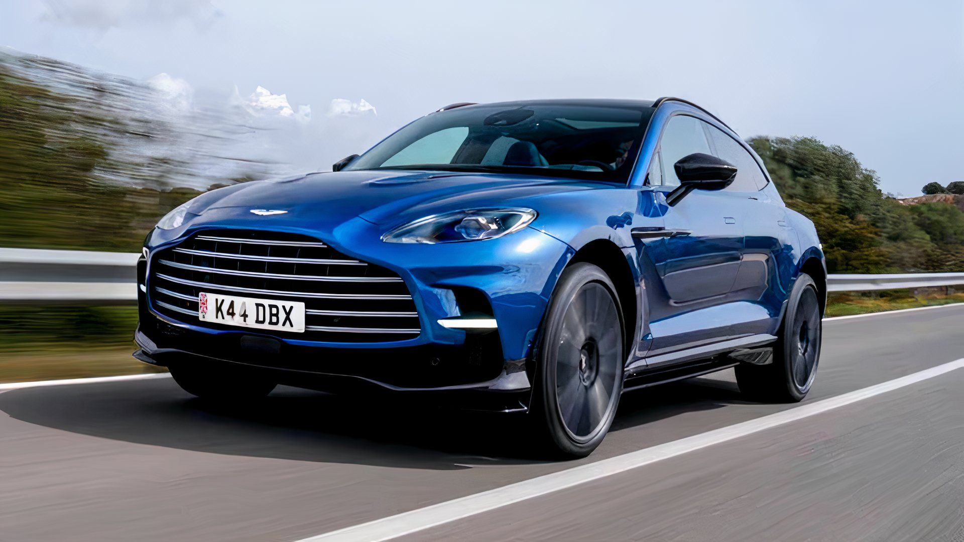 2024 Aston Martin DBX707 in blue Driving on highway