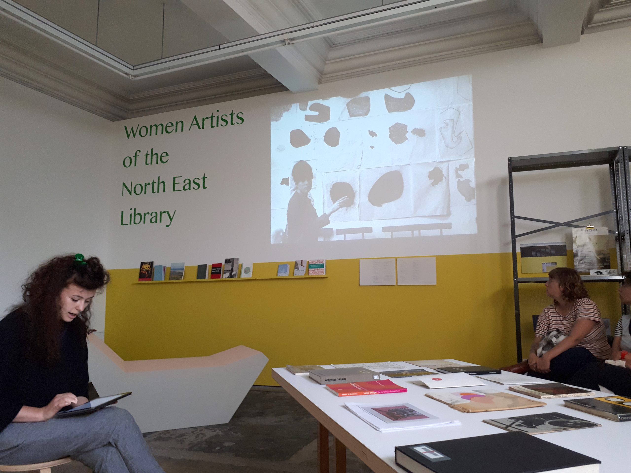 Harriet Sutcliffe (left) in the Women Artists of the North East Library, Workplace Foundation