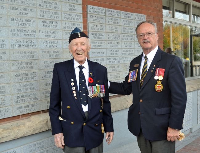 Fred Davies, left, looks on at Branch 34 president Rick Purcell unveils a paver Davies had placed in memory of Gladys Lillicrap.