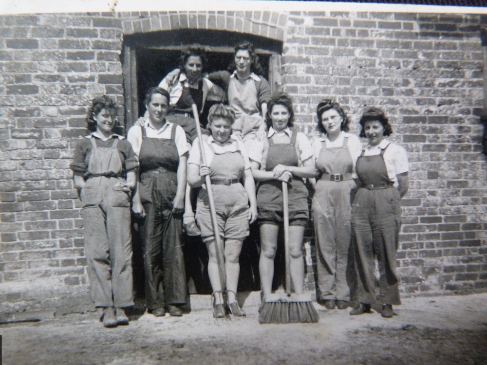 Betty Parker with her colleague. Betty is at the front, third from the left, holding a pitch-fork! c.1944