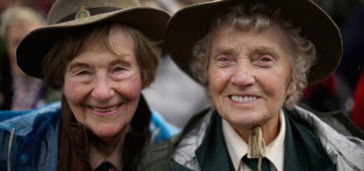 STAFFORD, ENGLAND - OCTOBER 21: Former Land Girls Iris Halfpenny (L) and Iris Newbould smile as they brave the high winds during the dedication ceremony of the new memorial to honour women who served in the Land Army during World War Two at The National Memorial Arboretum on October 21, 2014 in Stafford, England. The new bronze memorial, depicting a Land Girl and Lumber Jill was unveiled by Sophie, Countess of Wessex, with the ceremony being attended by more than 400 former Land Army girls. (Photo by Christopher Furlong/Getty Images)