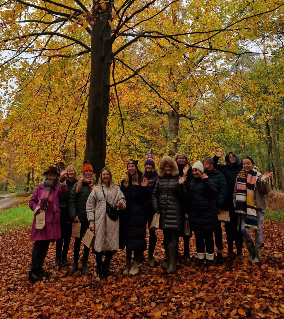 autumn-retreat Group of women smiling in woodland enjoying autumn yoga and mindulness retreat