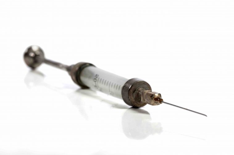 man injects himself with his semen