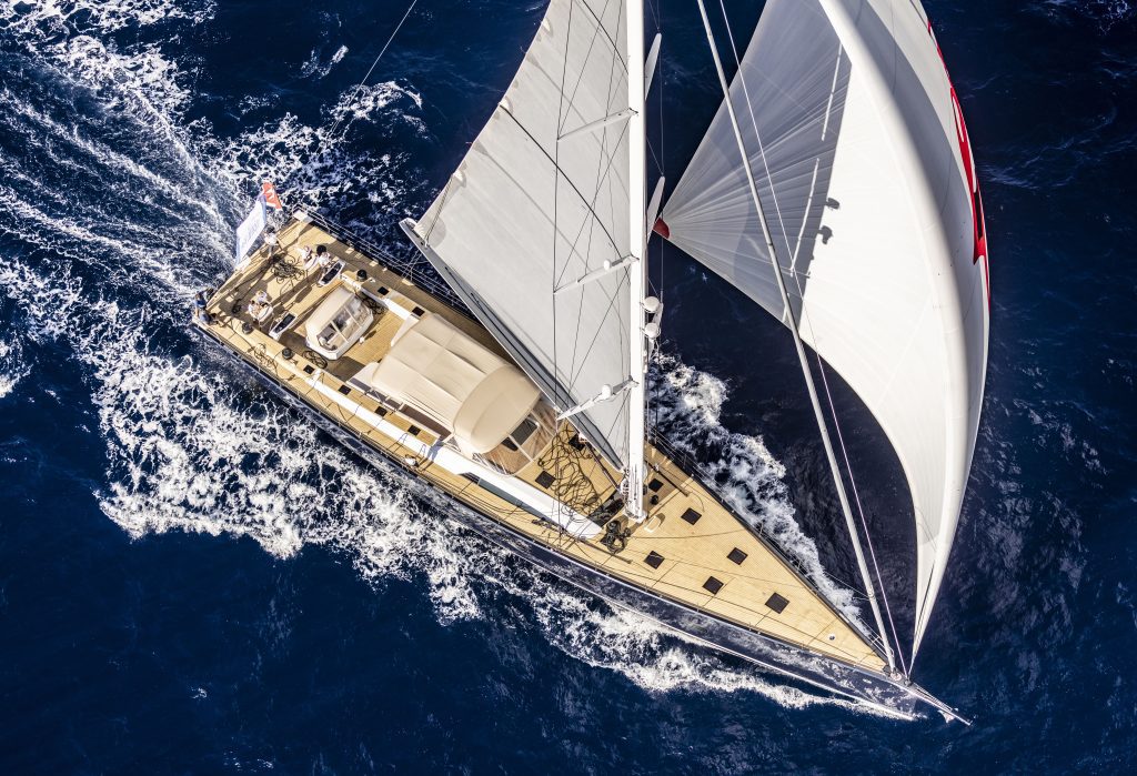 An aerial view of a Southern Wind company sailyacht sailing gracefully in the vast ocean.