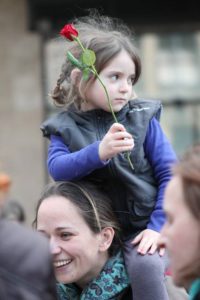 A little girl with her mother is taking part in the demonstration for obstetric rights in Hungary