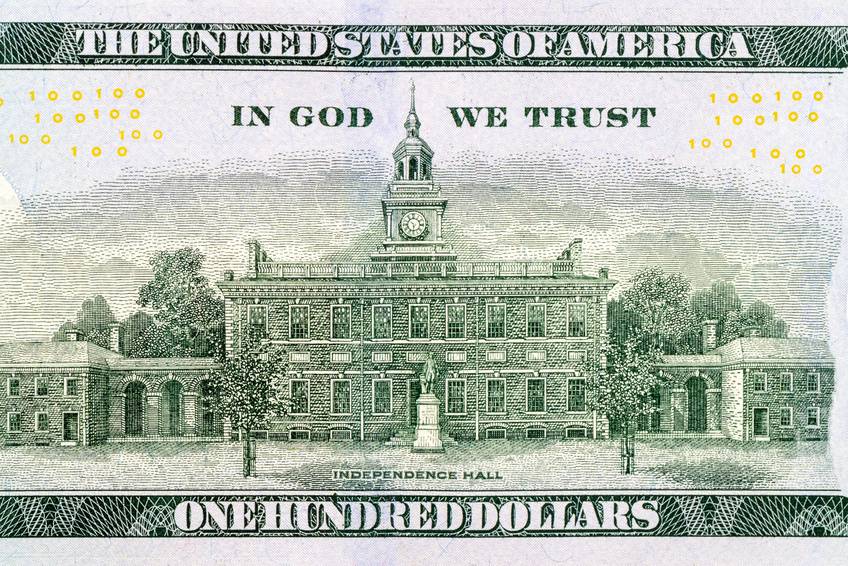 100 US dollar bills with in God we trust text. Background