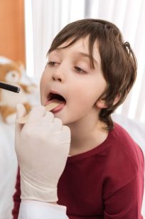 man-doctor-examining-throat-of-little-boy-in-hospi-2021-09-03-16-51-18-utc-e1644252180701.jpg man-doctor-examining-throat-of-little-boy-in-hospi-2021-09-03-16-51-18-utc-e1644252180701.jpg